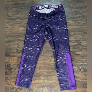 Under Armour compression 3/4 leggings, women’s size medium, purple design.